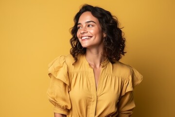 Sticker - Portrait of a happy young woman smiling over yellow background. Looking up