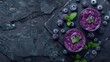 © Amanda112 - Vibrant Acai Smoothie with Fresh Blueberries on Black Stone Surface