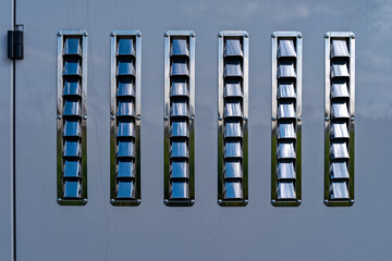 Shiny metal vents on the back of a boat cleaning machine