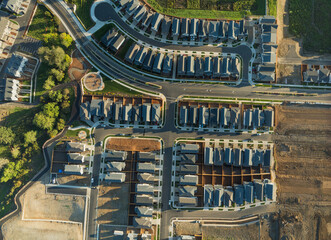 A residential area with many houses and a few empty lots