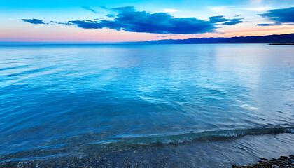 Beautiful sunsets over Qinghai Lake with serene waves.