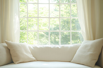 A close-up shot of the window seat, with two white pillows & soft cream curtains framing it. The window features an open glass-paned design and is set against a background of lush green trees outside.