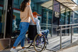 © Westend61 - Caregiver pushing senior man in wheelchair on ramp