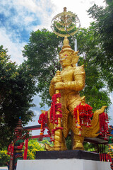 giant statues are thai art that represent thao wessuwan, commonly found in thai temples.