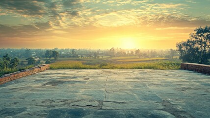 Wall Mural - Beautiful sunrise over rural landscape with stone terrace looking out onto fields and trees