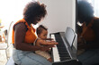 © ADDICTIVE STOCK - African mother teaching her baby girl to play piano