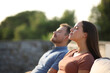 © Antonioguillem - Relaxed couple breathing fresh air in a terrace