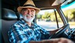© Ilja - Smiling Senior Truck Driver in Straw Hat Behind the Wheel, Happy and Experienced on the Road