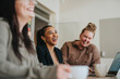 © Maskot - Happy female business professionals at meeting in office