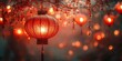 © Мария Фадеева - A traditional red Chinese lantern glowing warmly, surrounded by flowers and soft bokeh lights, evoking the festive spirit of the Chinese New Year.