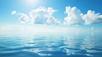 Bright blue ocean waters under a clear sky with fluffy white clouds at midday