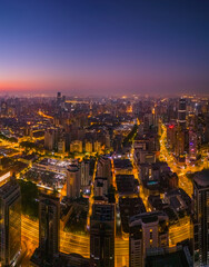 Aerial view of modern city skyline and buildings at sunrise in Shanghai