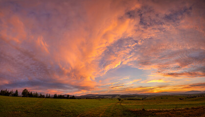 Wall Mural - beautiful,dramatic sky illuminated by the sun during sunset-panorama