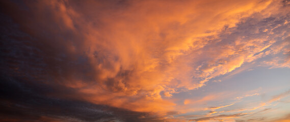 Wall Mural - beautiful,dramatic sky illuminated by the sun during sunset-panorama