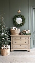 A warm, inviting living space features a wooden chest of drawers topped with a festive garland, alongside a beautifully adorned Christmas tree against a green wall