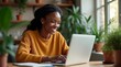 © Lucas - Happy black woman working home office with her laptop