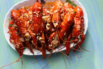 Wall Mural - plate of traditional garlicky spicy sichuan red crawfish