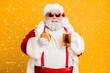 © deagreez - Portrait of funny funky santa claus with big belly want relax rest on x-mas celebration party hold glass of beer meat sandwich wear stylish suspenders red hat headwear isolated yellow color background