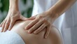 © Wimon - A physical therapist applying gentle pressure to a patients back, symbolizing the healing power of touch and the importance of body alignment.