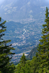 Aerial view of Italian City of Meran with Etsch Valley and Etsch River seen from mountain resort Meran 2000 on a sunny summer day. Photo taken July 18th, 2024, Meran Merano, Italy.