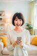 © onehourhappiness - Happy Woman Using Smartphone with Joyful Expression in Casual Setting