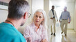 © Monkey Business - Doctor Having Serious Conversation With Mature Woman In Hospital Corridor