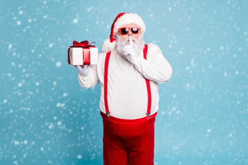 Wall Mural - hush its secret portrait of focused funny funky fat santa claus with big abdomen belly prepare gift 