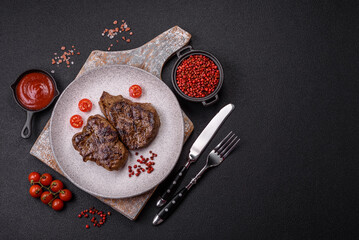 Juicy beef steak grilled with salt, spices and herbs