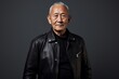 © Markus Schröder - Portrait of a tender asian man in his 80s sporting a classic leather jacket on plain cyclorama studio wall