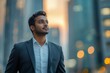 © Lifetouch AI - Confident rich eastern Indian businessman executive standing in a modern big city looking and dreaming of future business success, thinking of new goals, business vision, and leadership, Generative AI
