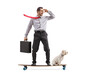 © Ljupco Smokovski - Full length profile shot of a businessman with a briefcase riding a longboard with his dog