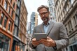 © Visual Odyssey - Successful Executive Standing in City, Using Digital Tablet and Smartphone for Business Communication, Generative AI