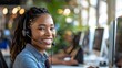 © Mrzproducer - smiling female call center agent with a headset, providing customer service in a modern office environment filled with greenery.