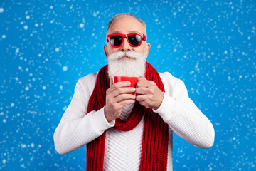 Poster - Photo of sweet funny age gentleman wear white sweater red eyewear smiling enjoying coffee isolated blue color background