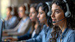 © Mrzproducer - Professional call center agent focused on customer support, utilizing a headset and computer in a modern office environment.