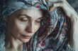 © Emma - A woman adjusting a headscarf, covering her thinning hair, with the scarf partially revealing patches of the scalp, personal coping mechanism, soft emotional tone