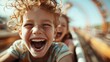 © svastix - A young child, hair blown back in excitement, rides the rollercoaster, capturing the thrill and joy of the amusement park's adventurous atmosphere and cheerful setting.