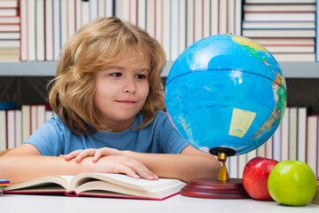 Fototapete - School kid student learning, study language or literature at school. Elementary school child. Portrait of nerd pupil studying.