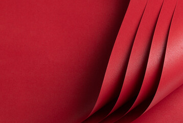 Aufkleber - Scarlet red paper with a rich, saturated tone and geometric pattern. The minimalist, monochrome surface features layered folds and bent lines, creating a premium and elegant