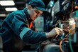 © Nikolai - Focused technician working on industrial machine wiring