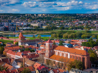 Wall Mural - Kaunas old town with cathedral in front, Lithuania. Panoramic drone aerial view photo of Kaunas city center with many historical buildings