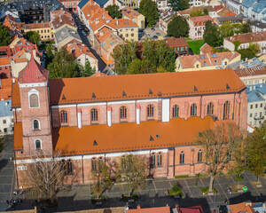 Wall Mural - Kaunas old town with cathedral in front, Lithuania. Panoramic drone aerial view photo of Kaunas city center with many historical buildings