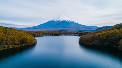 Sticker - Aerial view of Mount Fuji framed by a serene lake and traditional Japanese buildings in the foreground 