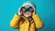© Johannes - Happy child with Binoculars on blue background, Look to future concept.