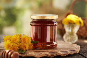 Wall Mural - A jar of dandelion honey - syrup made of fresh Taraxacum flowers in spring