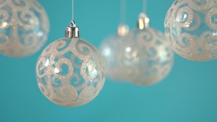 Wall Mural - christmas baubles hanging against blue background. christmas decoration.