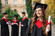 © New Africa - Happy students with diplomas after graduation ceremony outdoors, selective focus