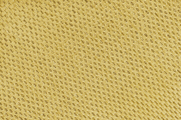 Texture of yellow jacquard fabric of diagonal rough weave cloth structure macro background