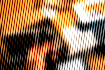 Pixelated image in orange tones, focusing on abstract facial details, representing digital art, modern media, and abstraction