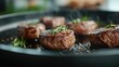 © Vuvimages - Sizzling steak medallions are cooked in a skillet, garnished with herbs, with steam rising, showcasing a mouthwatering culinary experience of premium quality.